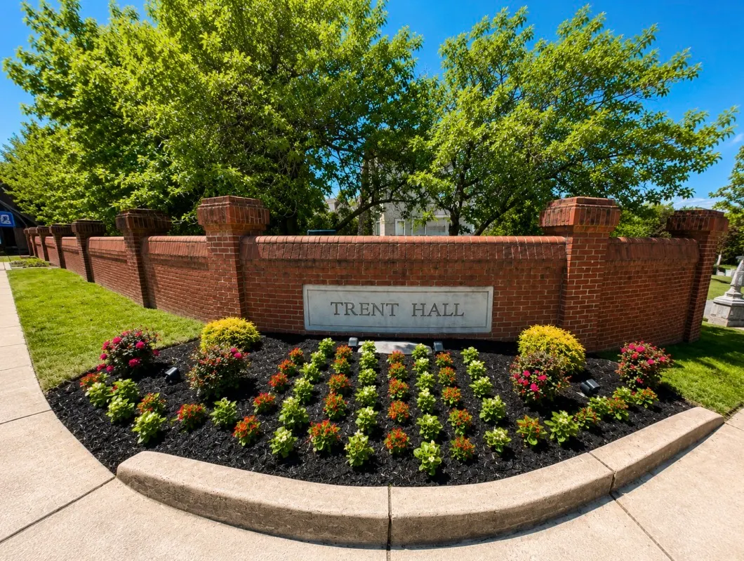 Landscaped flower bed at the Trent Hall brick entrance monument
